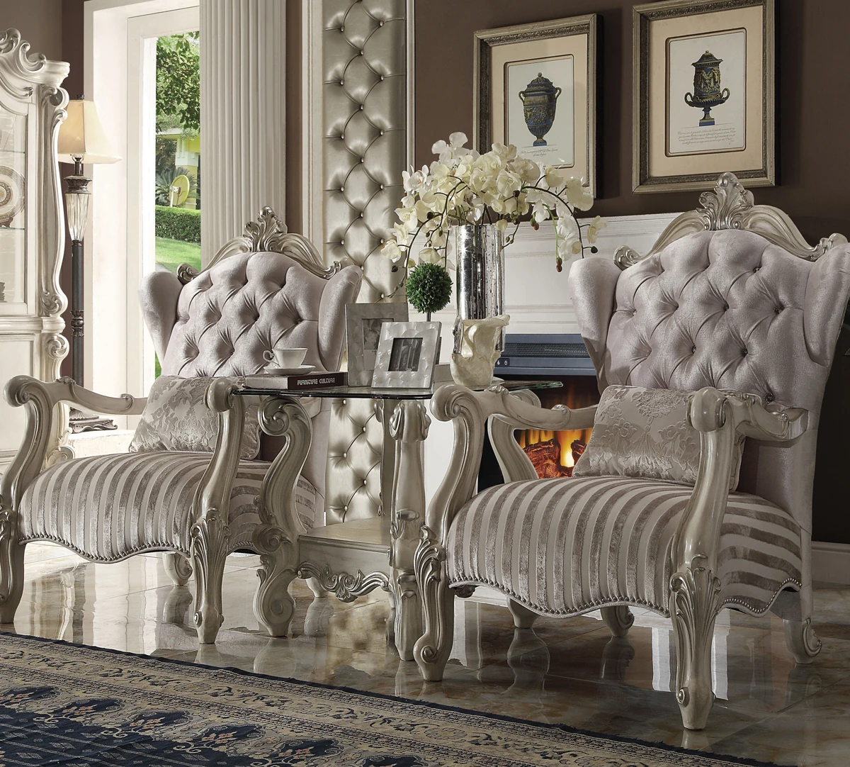 Accent chairs, an occasional table and decorative accessories in an elegant interior.